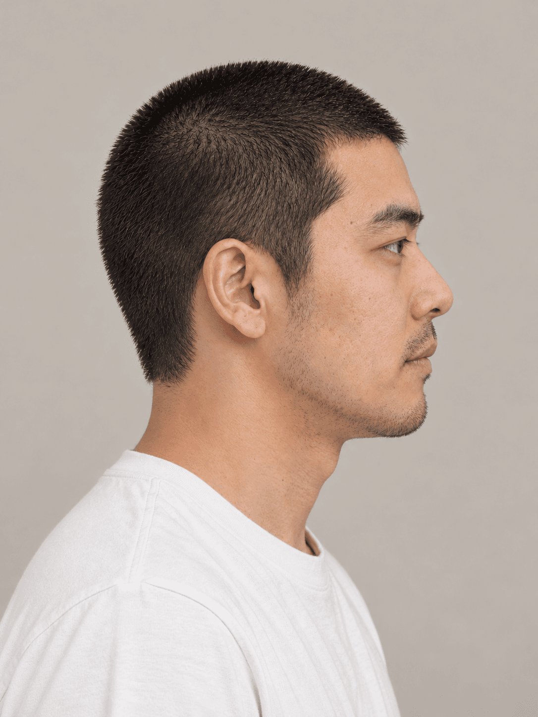 Buzz Cut on a man with straight black hair, side view