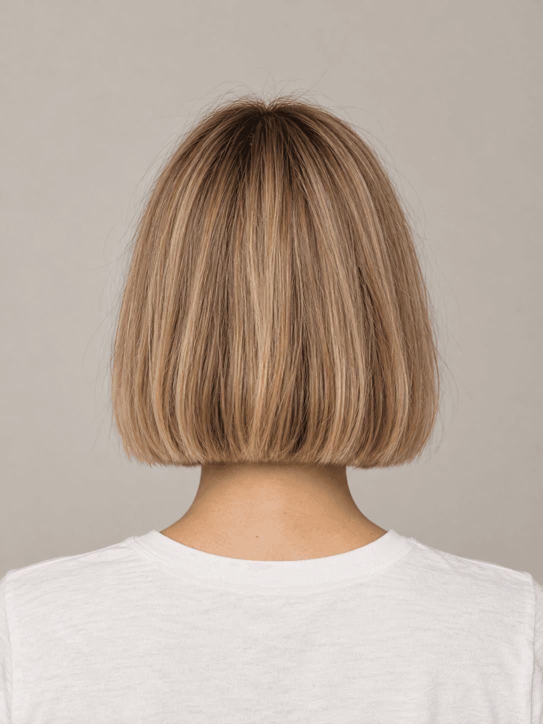 Classic bob hairstyle on a woman with blonde straight hair, back view