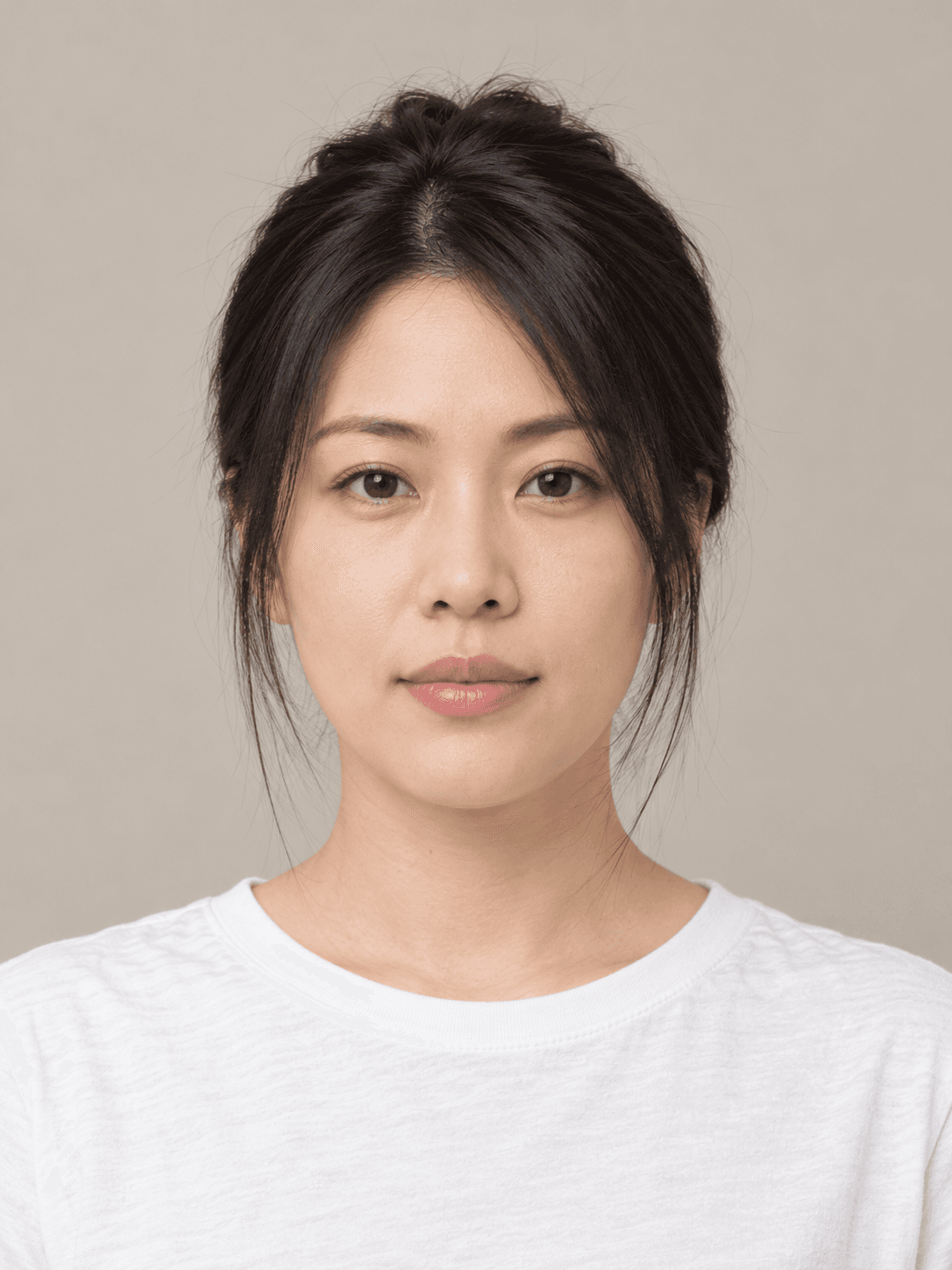 Claw-clip twist on a woman with light skin and straight black hair, front view