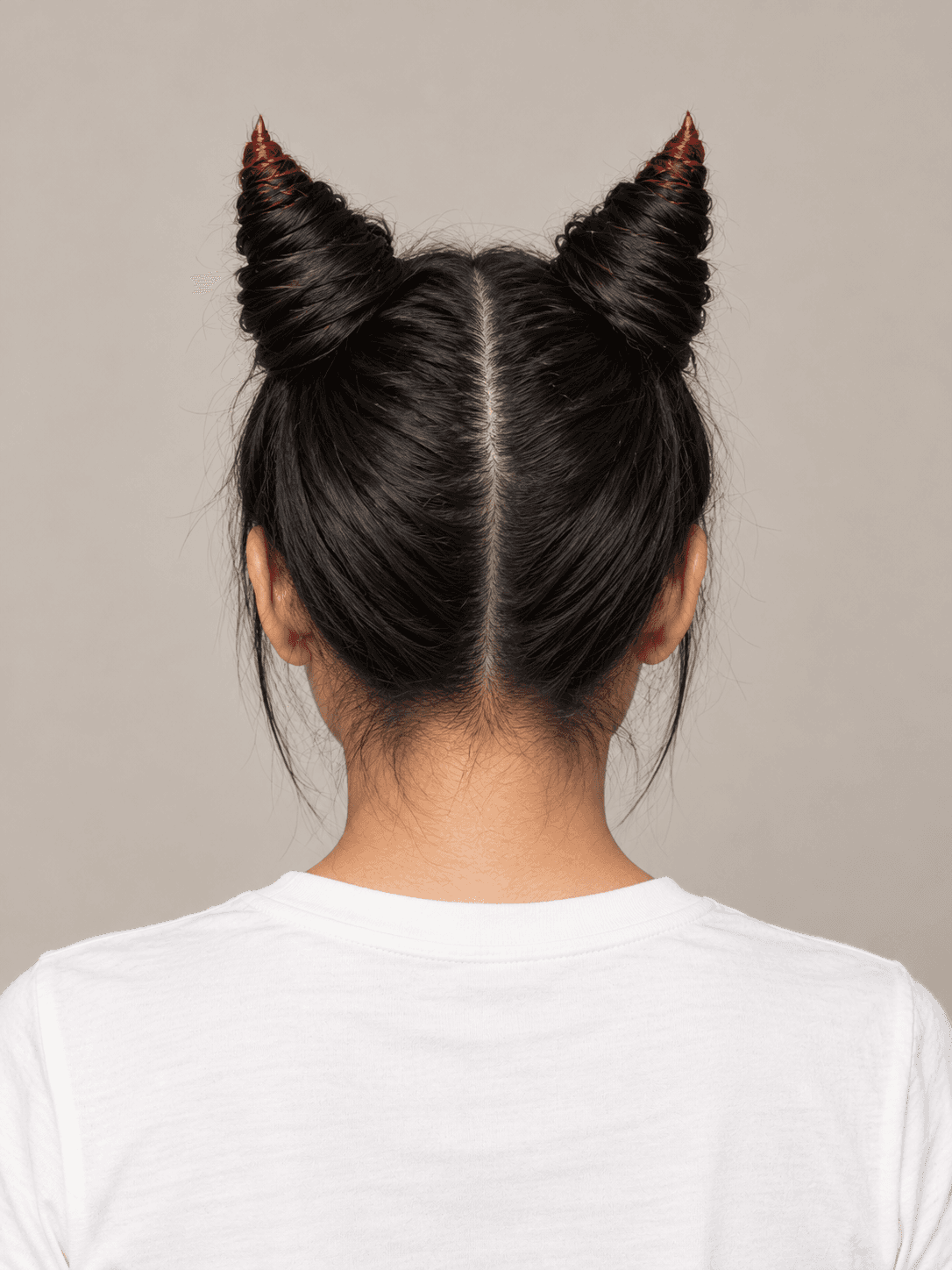 Horn Buns on a woman with light tan skin and black hair, back view