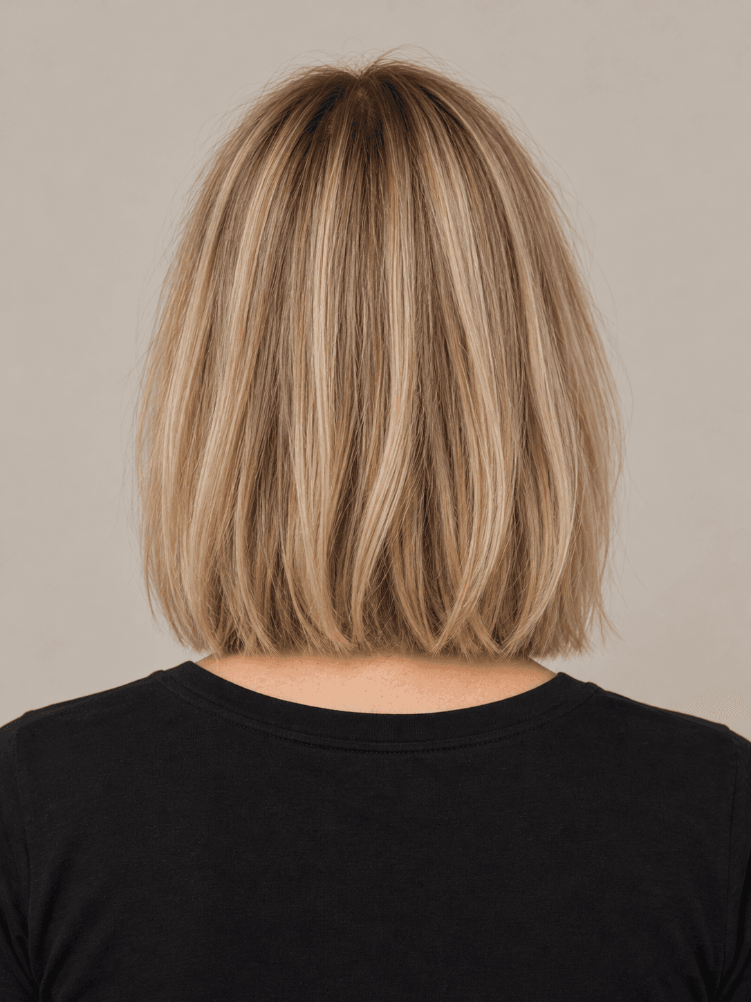 Lob hairstyle on a woman with straight mid-blonde hair, back view