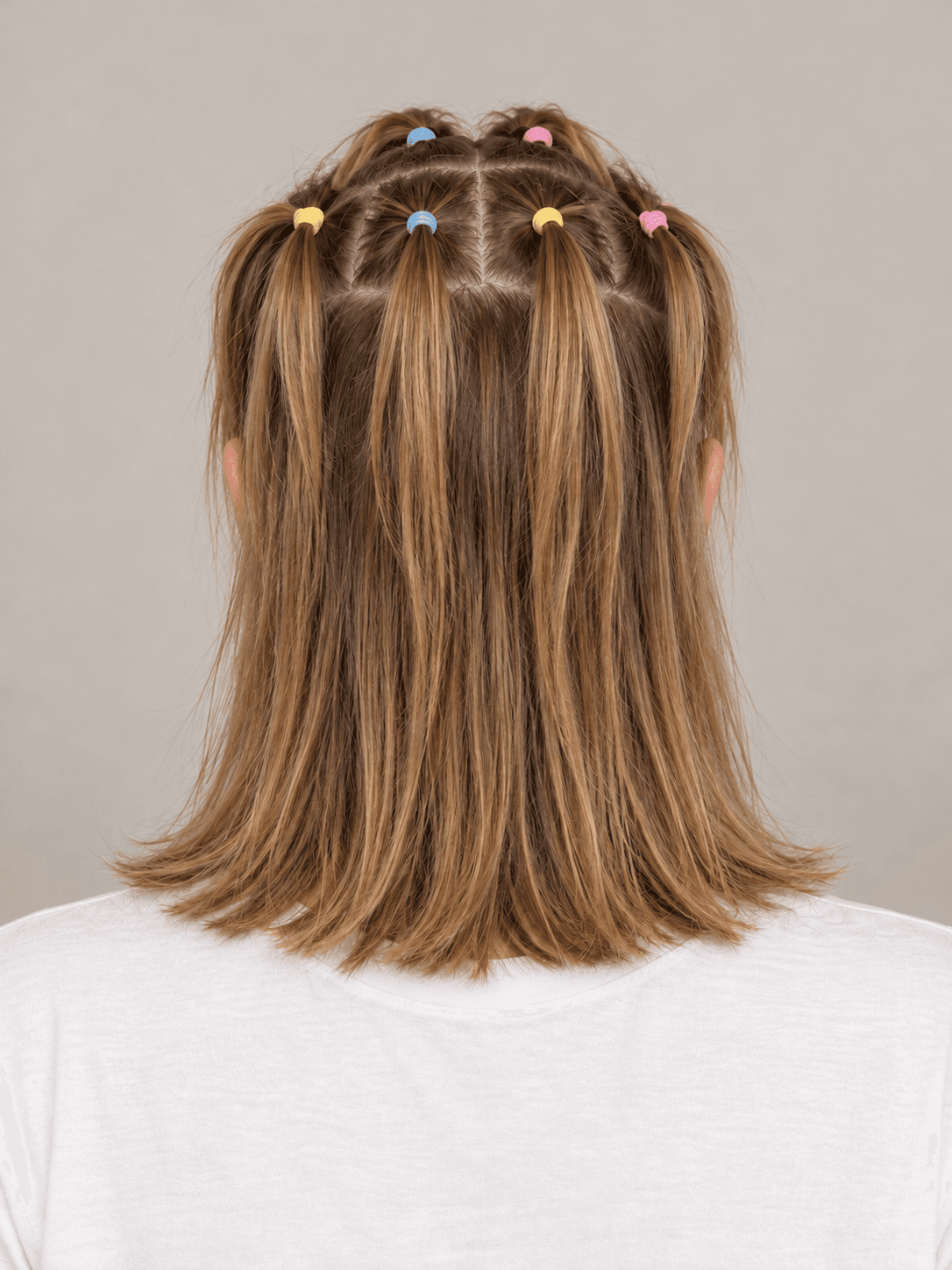 Mini Ponytail Grid on a woman with fair skin and light brown hair, back view