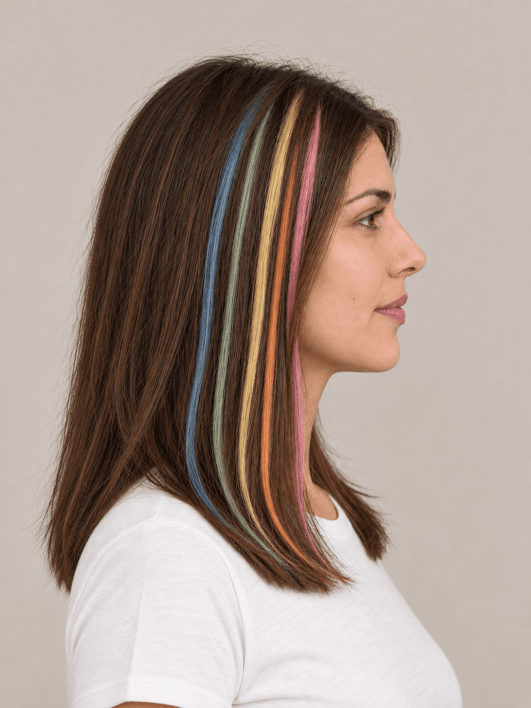 Rainbow Chalk Streaks on a woman with light skin and brown hair, side view