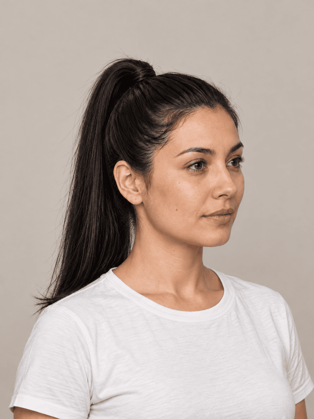 Sleek High Ponytail on a woman with light olive skin and straight black hair, three-quarter view