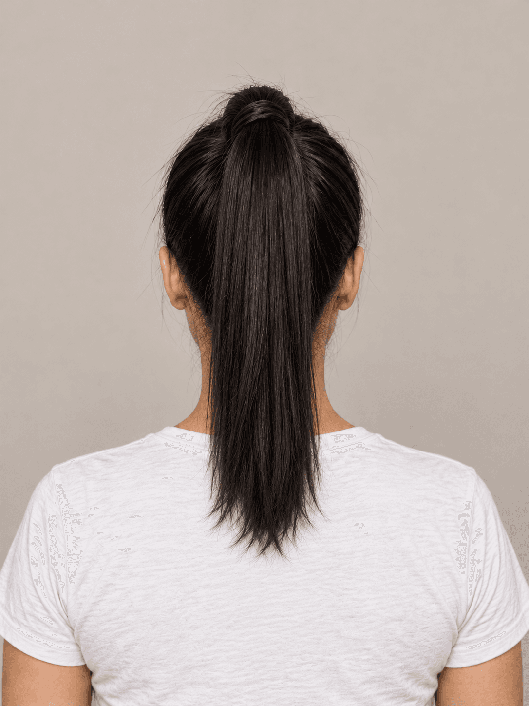 Sleek High Ponytail on a woman with light olive skin and straight black hair, back view