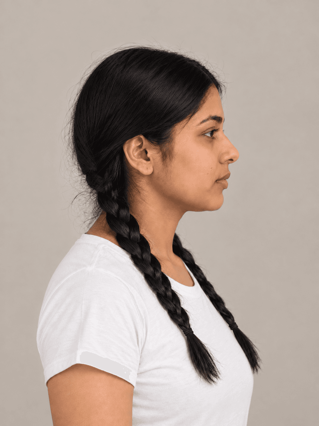 Wednesday Addams Braids on a woman with light brown skin and straight black hair, side view