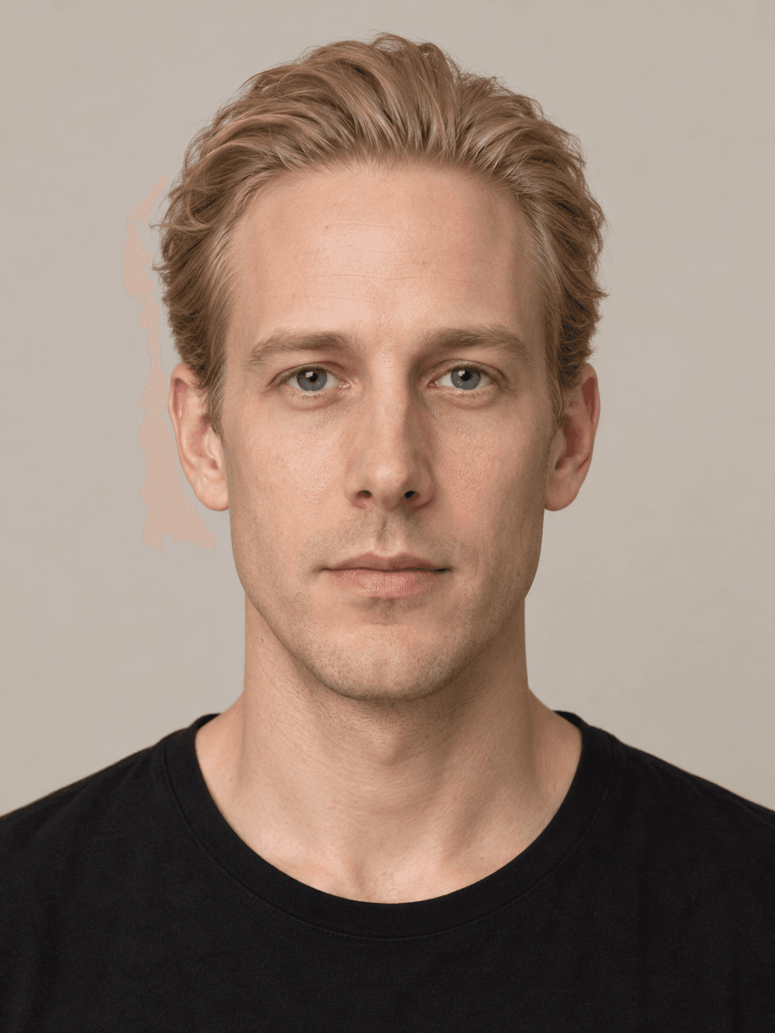 Man, front view, with fair skin and straight fair blond hair brushed straight back.