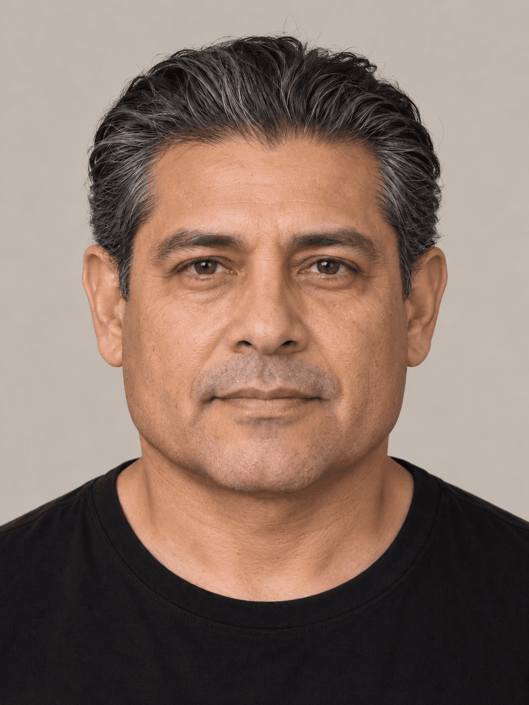 Man, front view, with medium warm-toned skin and straight black hair with grey, brushed straight back.